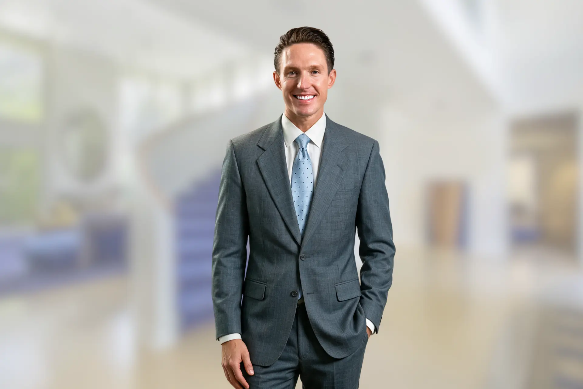 Mike Wilen standing in a soft-focus luxury interior
